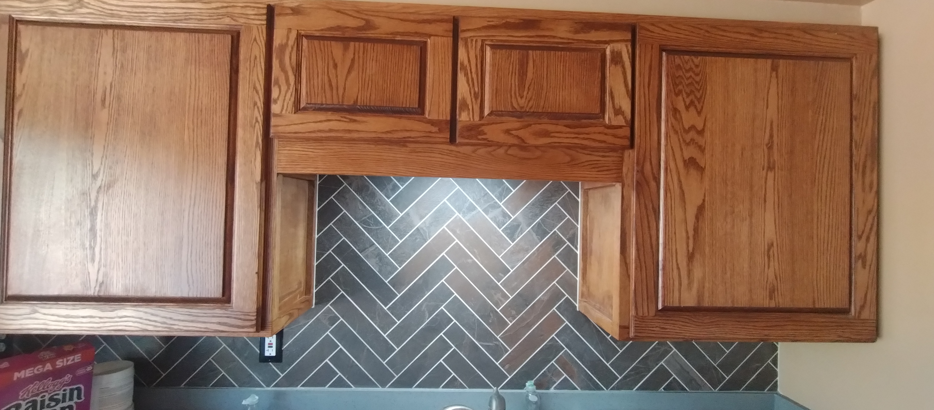 Kitchen Sink, Upper Cabinets, Herringbone Backsplash & Recessed Lighting